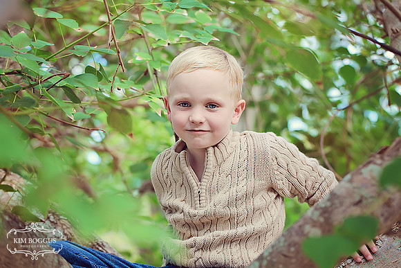 Christmas portrait, christmas lights bokeh, Joy sign, red pajamas Children's Photographer McAllen, TX, RGV